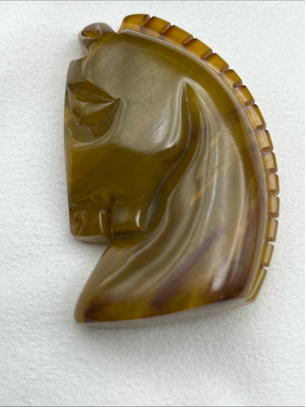 Vintage bakelite horse head brooch olive green swirl color